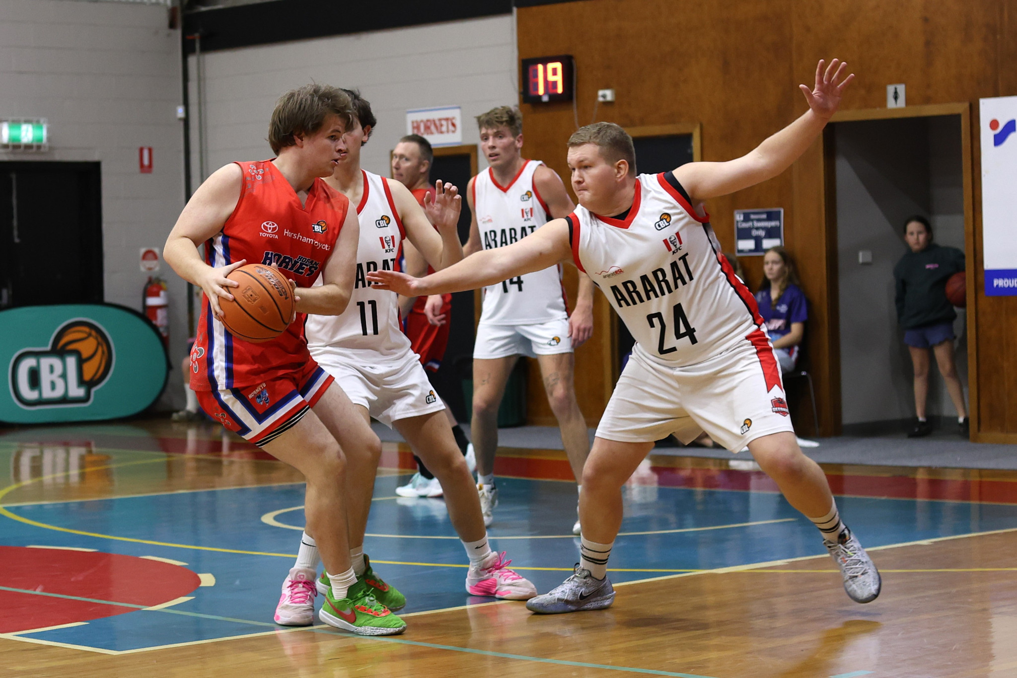 Redbacks’ Felix Oliver tries to defend Hornets’ Hugh Dougherty. PHOTO: RAELENE JOHNSTON