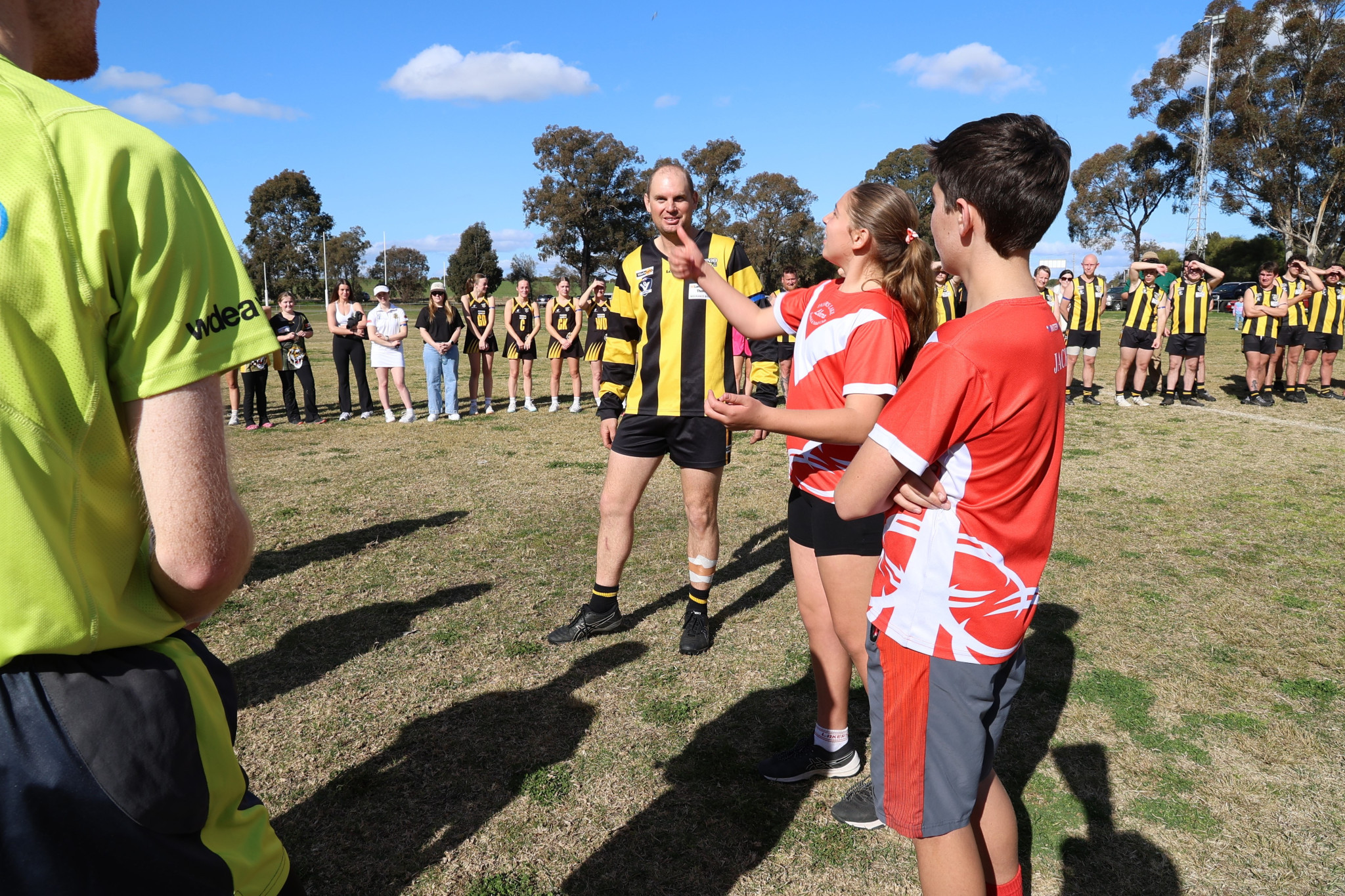 John’s daughter Charlotte tosses the coin. PHOTO: RAELENE JOHNSTON