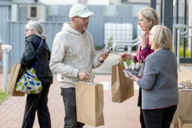 New residents accepted goody bags from volunteers as they were welcomed into the community.