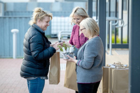 Dee Devlin accepts her goody bag and a plant.