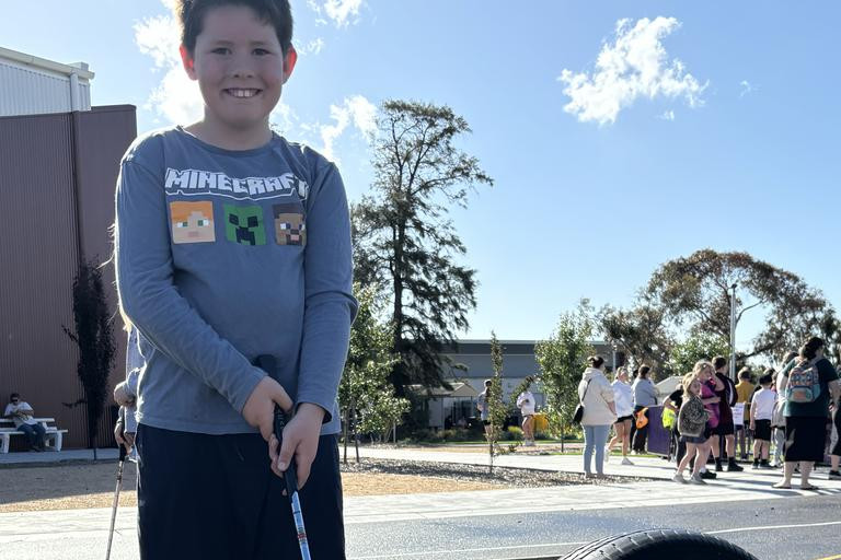 Thomas Sawrey, 8, gives the mini golf course a shot.