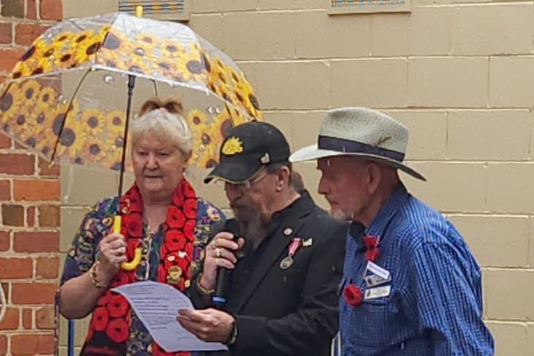 Pam Hubbard (left) and Dimboola RSL president Charles Rees (right) with Dimboola RSL vice president Wayne Myers as he recites the Military Poem. Photos: DEE DEVLIN