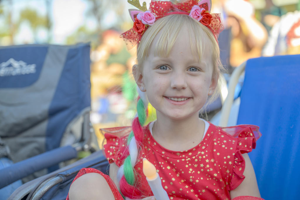 Lucy Rethus, 5, enjoying the festivities at Carols by Candlelight. Photo: ROBIN WEBB