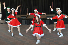 Dancers entertain the crowd as they celebrate the festive season with synchronised moves to Christmas tunes.