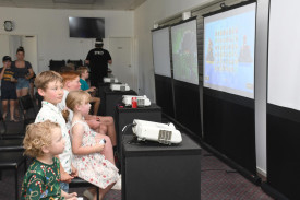 Samuel Woods 4, the son of Dion and Lisa Woods, is captivated by Level Up Gaming which entertained the children.