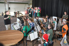 The Warracknabeal and District Band perform popular Christmas tunes with the carol singers.