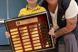 Prep student Kyzer N with the Linc Spirit Award plaque presented by Brooke Holland. Photos: CAITLIN MENADUE