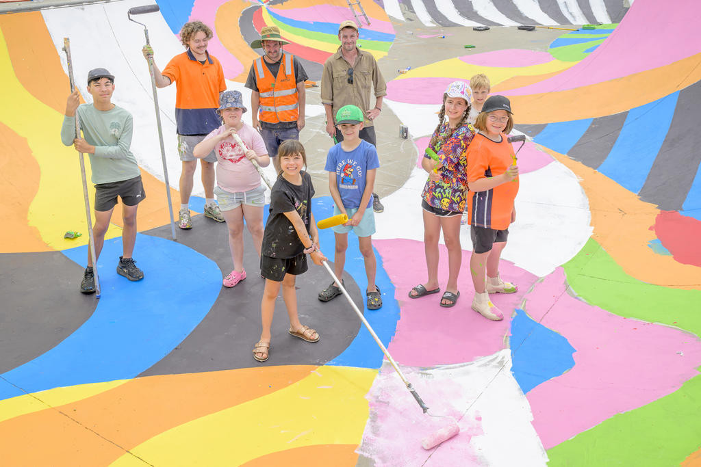 Blender Studios artists (at back) Louise Moore, Adrian Doyle and Matt Hannah with local youth painters. Photo: ROBIN WEBB