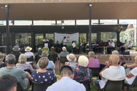 The crowd watches on as Janet Pilmore receives a Hindmarsh Lifetime Achievement Award from mayor Ron Ismay.