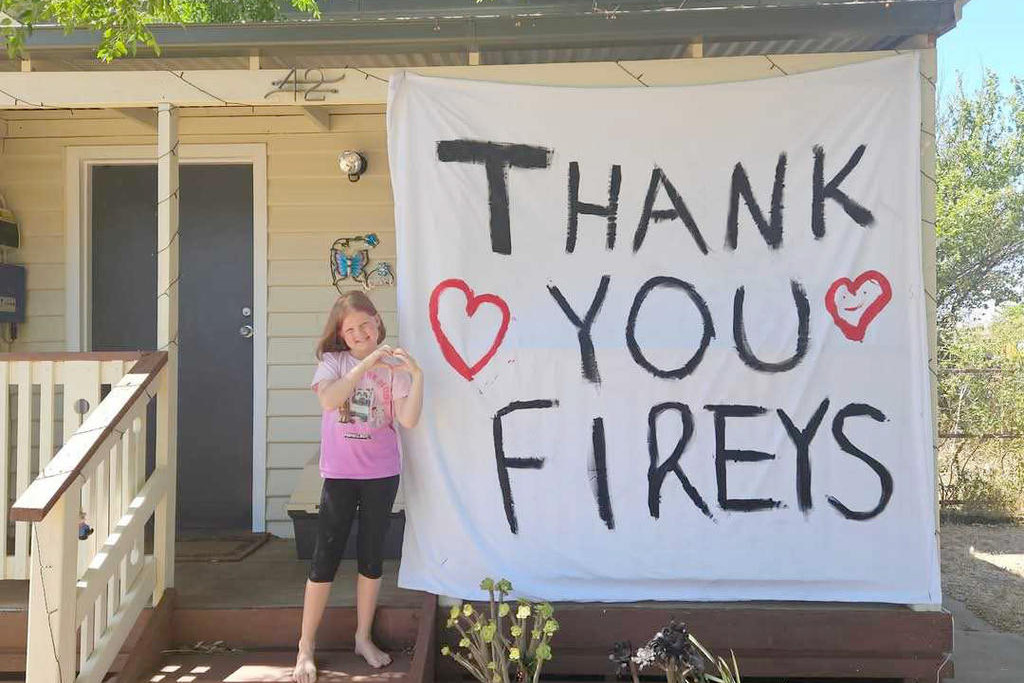 As Dimboola residents officially prepared to return to their homes late Tuesday after being evacuated almost 24 hours earlier, one little resident had a big message she wanted to share. Indie Francis, who lives in Lloyd Street, Dimboola, and her mum, Bree Myers, were scared they wouldn't have a home to return to after fires threatened the town. But thankfully, through the hard work of CFA members, the town has been saved, with barriers in place from potential flare-ups. Indie, 7, said that the CFA members were better than superheroes, and Bree agreed, thanking them for saving their home and the town.