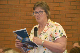 Kathy Ross asks a question during the meeting.
