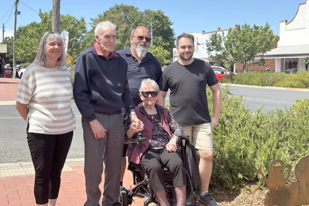 Jan Ballard (middle) with her husband Bill and their family.