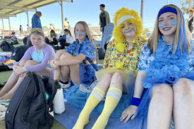 Emeila Martin, Rubiee Crisp, Charli Fennell and Kaylie Field cheer on their peers. Photo: CAITLIN MENADUE