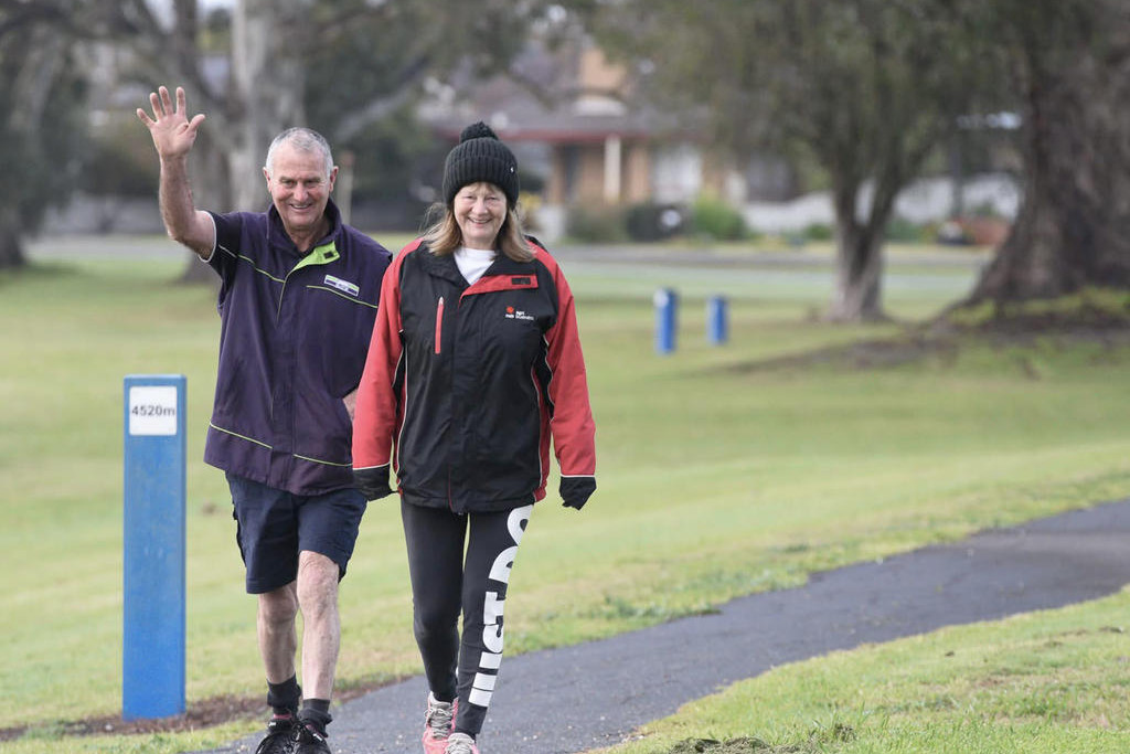 Greg ‘Rab’ Robertson waves to the camera as he powers through a walk.