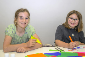 Pippa Holmes and Goldie Khune enjoy the creative kids’ activities. Photo: ROBIN WEBB