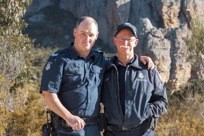 Leading Senior Constable Pete (right) and Senior Constable Aari, a father and son duo both serve in single-member police stations.