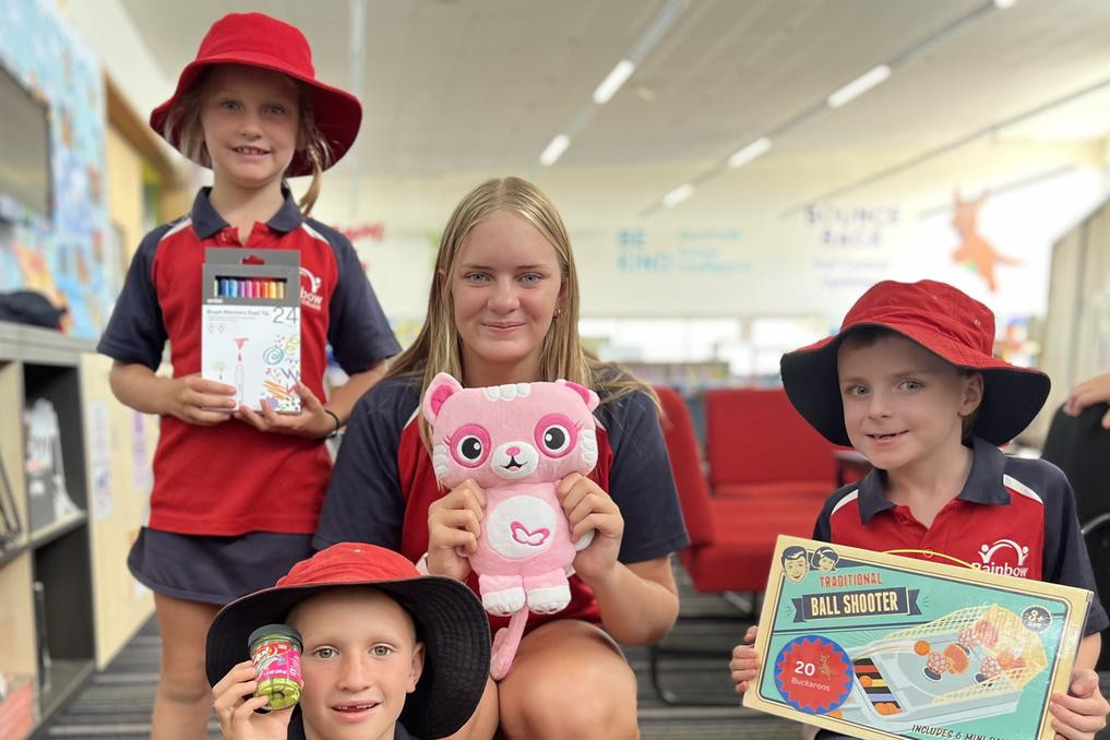 P-12 students Poppy (grade 1), Eliza (grade 9), Tom (grade 1), and Henry (grade 1) are feeling delighted after grabbing their favourite items from Jumpy's Emporium.