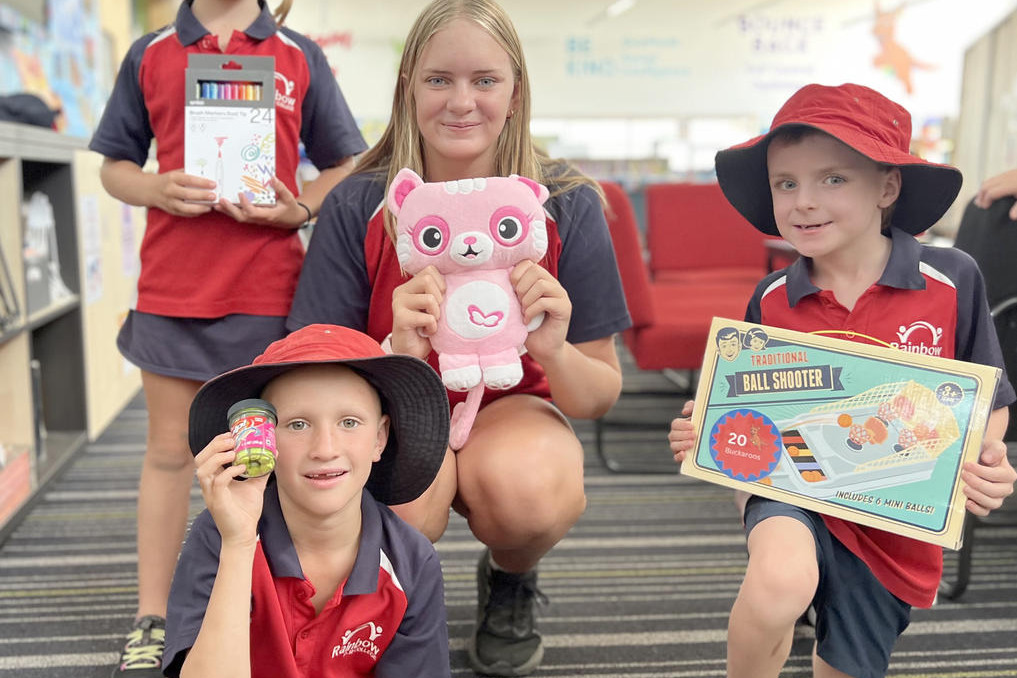 Rainbow P-12 students Poppy (grade 1), Eliza (grade 9), Tom (grade 1), and Henry (grade 1) are feeling delighted after grabbing their favourite items from Jumpy's Emporium.