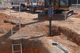 Contractors are creating pits for the elevator shaft to go into.