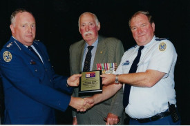 Stan Hendy receives his award for 25 years of VICSES in 2001.