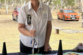 Janet Pilmore cuts a cake made for the occasion.
