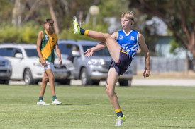 Charlie Bell of Nhill sends the ball downfield.
