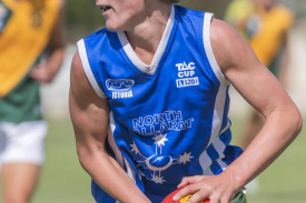 Dimboola’s Reef Ward looks downfield for a target.