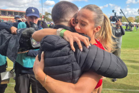 Bree Rizzo, the 2025 Powercor Women’s Gift champion, embraces her husband, Matt Rizzo, winner of the 2025 Stawell Gift
