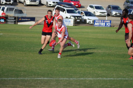Ararat’s Pat Toner gathers the ball as he is surrounded by Stawell players.