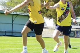 Dane George receiving from Kobe Macgregor during the relay race.