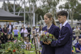 Holy Trinity Lutheran College’s school captains lay a wreath.