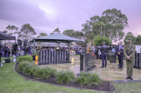 Many pay their respects as they attend the Anzac Day dawn service.