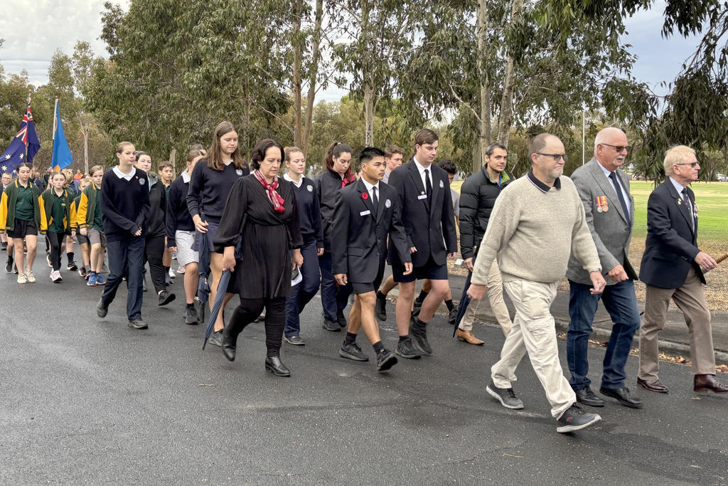 Many community members participate in the Anzac Day march in Dimboola, led by RSL president Charles Rees.