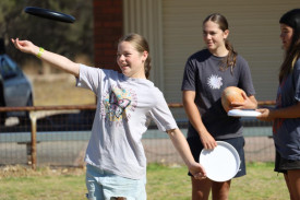Lydia Paech is throwing a frisbee during the Games Day in Jeparit.