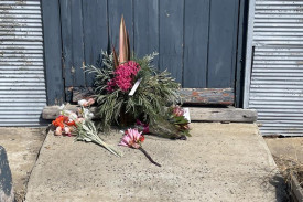 A wreath of flowers at the Kiata Hall door marks Friday’s Western Highway fatality.
