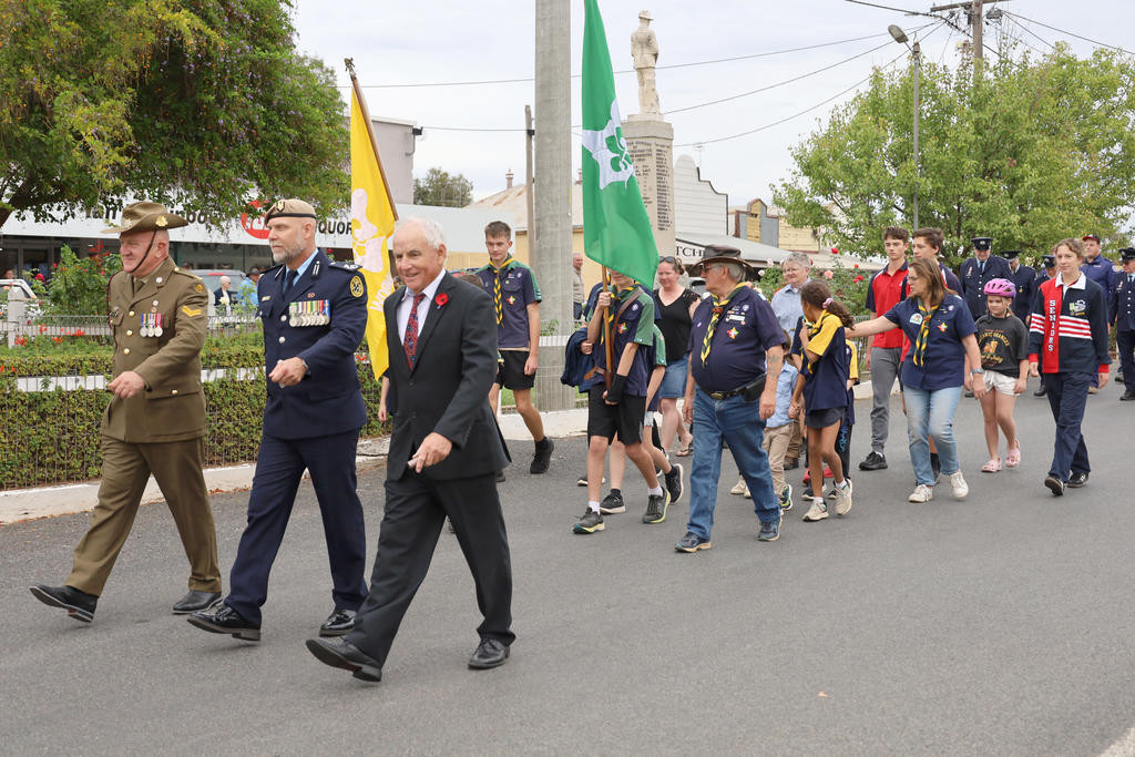 MAIN PIC FOR P1. Beginning of the ANZAC Day march on Federal Street last Friday, with Cr Roger Aitken, guest speaker of the day, Ryan Leffler and Peter Gosling leading the parade.