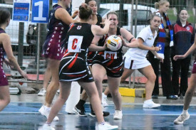 Erin Martin paases off to ANZAC medalist Ashlee Grace