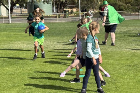 George sprints to the front of the line during tunnel ball.