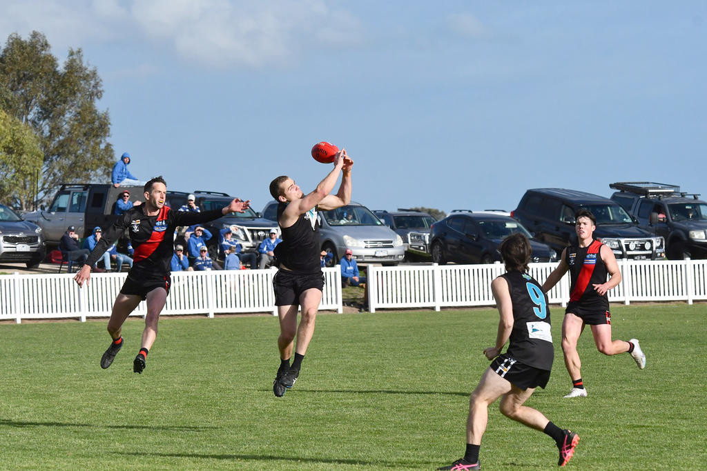 PLEASE CROP AROUND PAUL SUMMERS (WITH BALL). Paul Summers has been a focal point for his side this season, and is the leading goal scorer for the league.