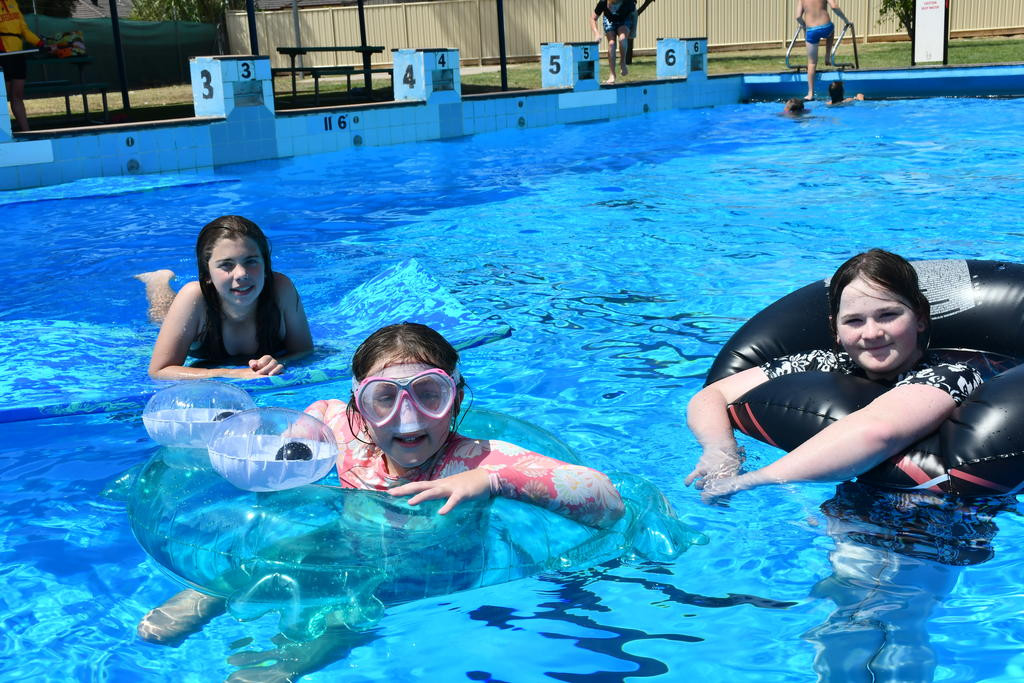 Dimboola kids Sierra, 12, Charlie, 11, and Hattie,11, are making a splash, beating the extreme weather with a swim in the Dimboola Swimming Pool.