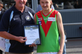 Blake Hadden receives his award from Horsham Blue Ribbon member Les Power.