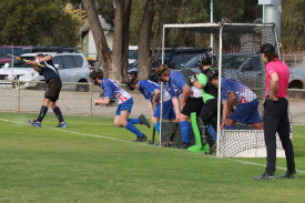 The Kanva Cobras’ defenders spring into action as Yanac Tiger Shaun Alexander hits the ball into play on a penalty corner.