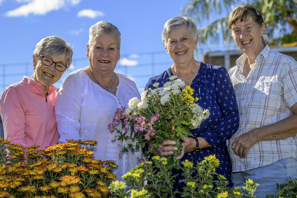 Members of the Wimmera Hospice Care, Lea Crammond, (President) Lesley Lane, Maureen Webb (Treasurer& Acting Secretary) with Jennie Mitchell in her garden. Photo: ROBIN WEBB