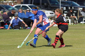 Kaniva’s Lisa Stimson runs the ball into attack despite pressure from Jets’ defender Sarah O’Connor.