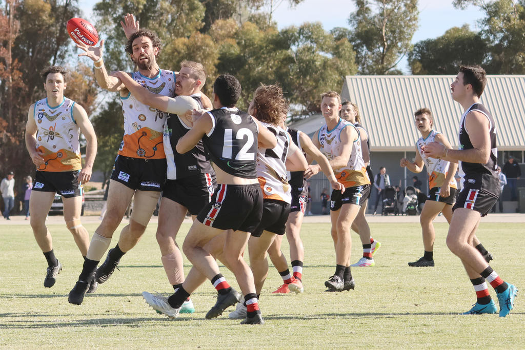 Jake Garvey and Angus Martin contest the ruck.
