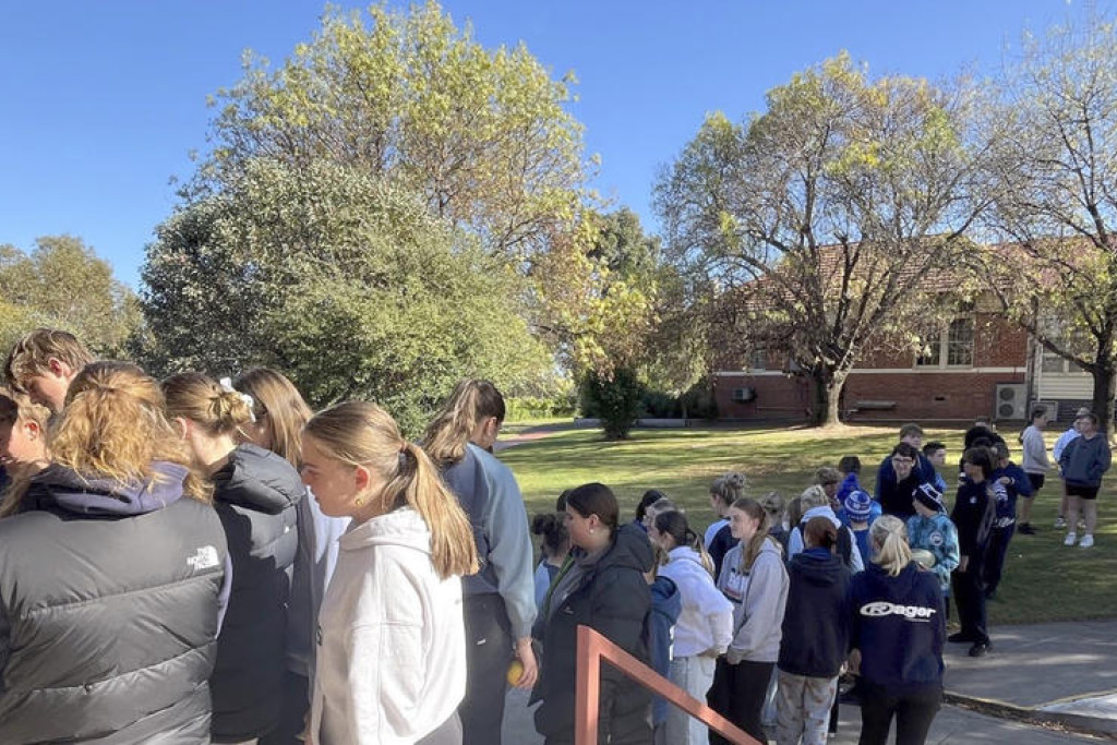 Students lined up during recess time to get a piece of cake in support of Dolly's Dream.