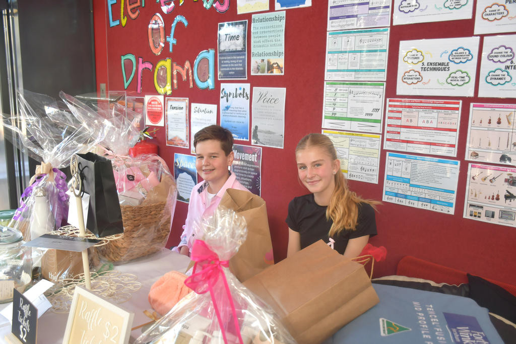 Students Jesse and Maya manning the raffle table during the high tea. Photo: CAITLIN MENADUE