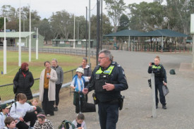 Local police officer speaking to students and parents last Friday.