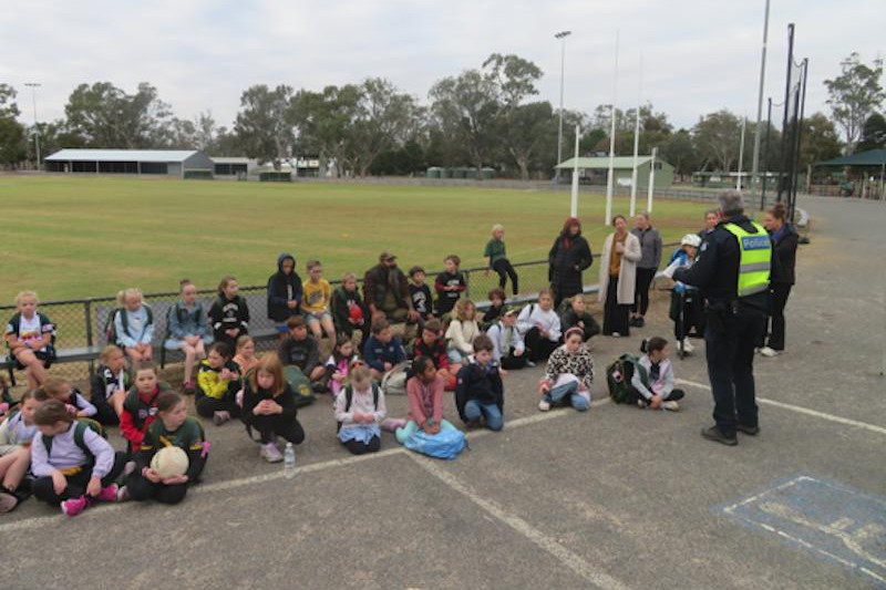 Dimboola Primary School students listening to local police officers last Friday morning for 'Walk safely to School Day'.