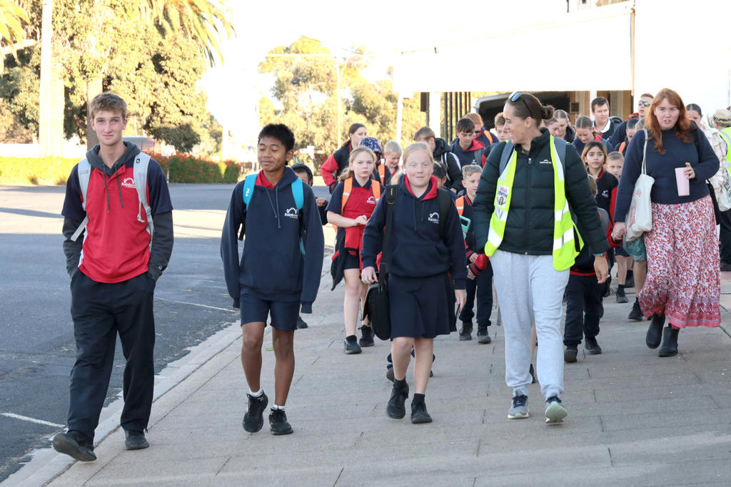 Students join the Walking School Bus on King Street for Walk Safely to School Day, promoting active travel and road safety.